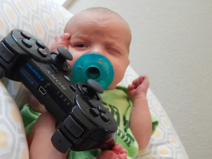 Baby in photos with game controller