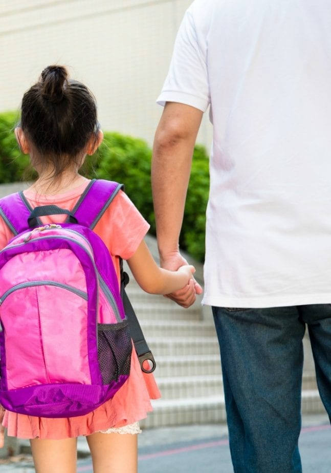 dad taking daughter to school