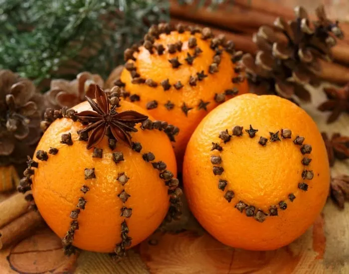 Cloves and oranges are a classic holiday craft that emulates the fresh and vibrant scents of the season