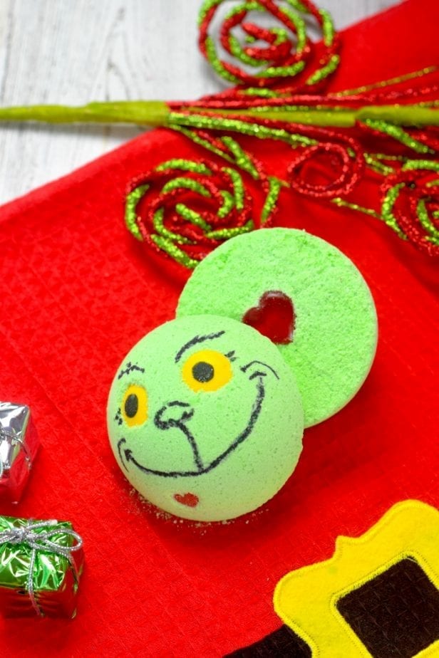 This Grinch bath bomb has a heart in the center that grows three sizes when it appears
