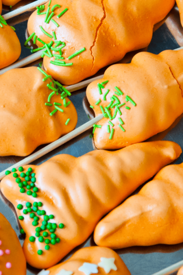 I'm a little in love with these Easter Carrot Meringue Cookies. They're literally the most perfect treat for Easter Egg Hunting EVER. #meringue #meringuecookies #recipe #easter