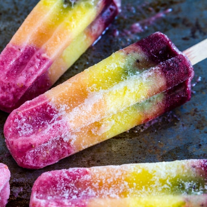 One of my favorite ways to trick my kids into eating veggies is these Magical Hidden Veggie Rainbow Popsicles. #hiddenveggies #popsicle