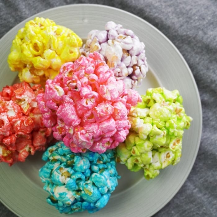 Oh, Snap! Easy Infinity Stone Popcorn Balls were out in the universe, but now they've been gathered--and I am so happy about it. #avengers #avengerspartyfood #avengerspartyidea #infinitywarfood #infinitystones #popcornballs