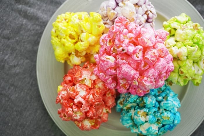 Oh, Snap! Easy Infinity Stone Popcorn Balls were out in the universe, but now they've been gathered--and I am so happy about it. #avengers #avengerspartyfood #avengerspartyidea #infinitywarfood #infinitystones #popcornballs