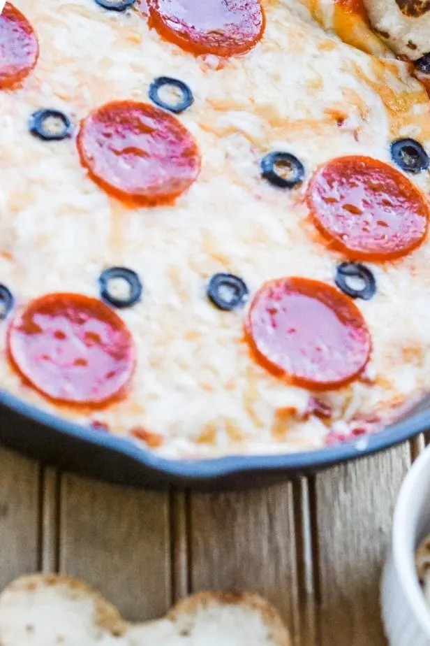 My kids were tired of the same-ole dinners, so I decided to make this fun Mickey Mouse Pizza Dip to mix it up! #weeknightdinnerrecipes #mickeymousefood #mickeymouseparty #pizza #pizzadip #pizzadiprecipe