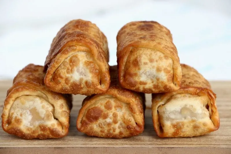 If you ever need a fun snack that really looks hard--but is actually super easy, these fun Peanut Butter Banana Egg Rolls are on the money. #eggroll #eggrollrecipes #snack #snackrecipes