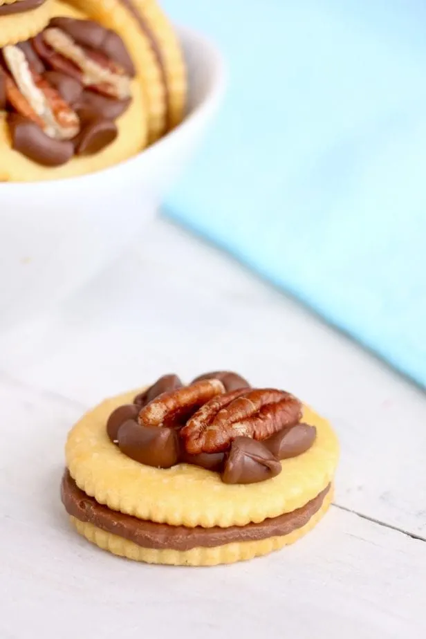 I wanted a really easy, but super tasty snack one afternoon and these Ritz Cracker Turtles came to mind--so easy and fast. #ritzcrackerrecipes #crackbark #crackercookies #snack