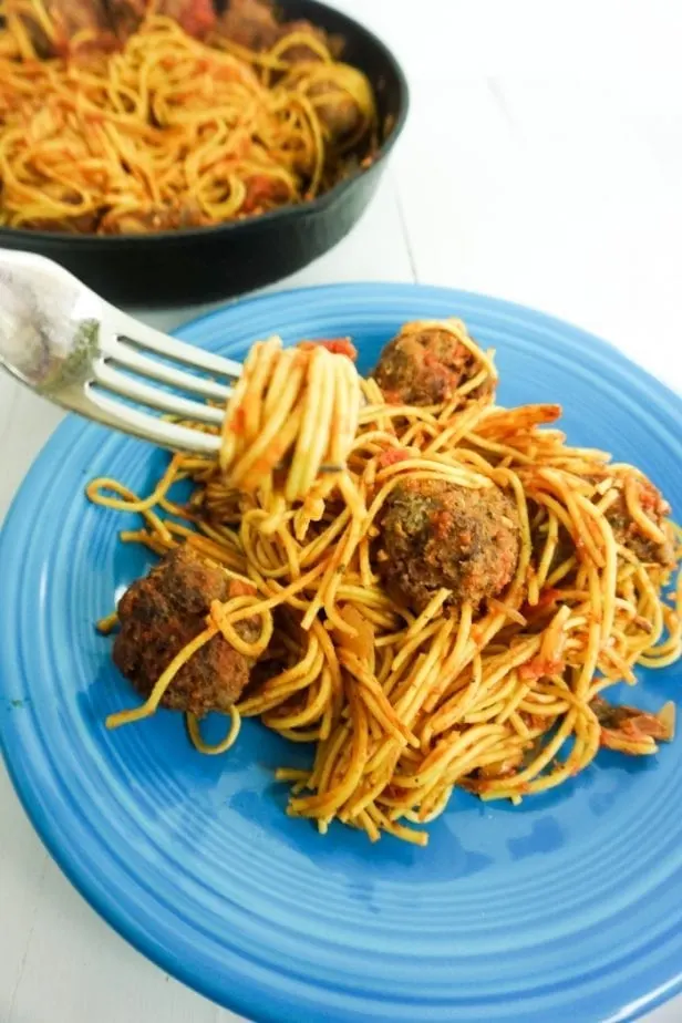 Skillet Spaghetti and Meatballs is the One-Pot Meal You've Waited Your Whole Life For. Not only is it ridiculously good comfort food, but it's easy to make and kind of fun. #onepanmeals #onepotmeals #skilletmeals #skilletspaghetti #spaghettiandmeatballs #meatballs