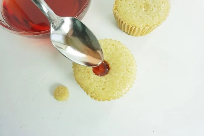 I am not kidding, for a little girl's night-in, these Boozy Strawberry Liqueur Cupcakes are so perfect. I die. #boozycupcake #drunkcupcake #strawberrycupcake #cupcake