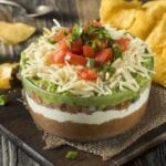 Homemade Chunky 7 Layer Dip with Beans, Sour Cream and Guacamole