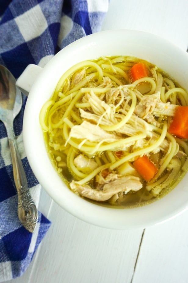 When I get sick or my kids are sick, I always want soup. And this is the Easiest Homemade Chicken Noodle Soup on the Planet. It'll knock your socks off with flavor. #chickennoodlesoup #howtomakechickennoodlesoup #homemadechickennoodlesoup
