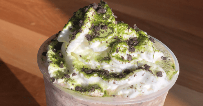 whipped cream, macha powder, and mini java chips top this sinfully sweet Oogie Boogie Frappuccino