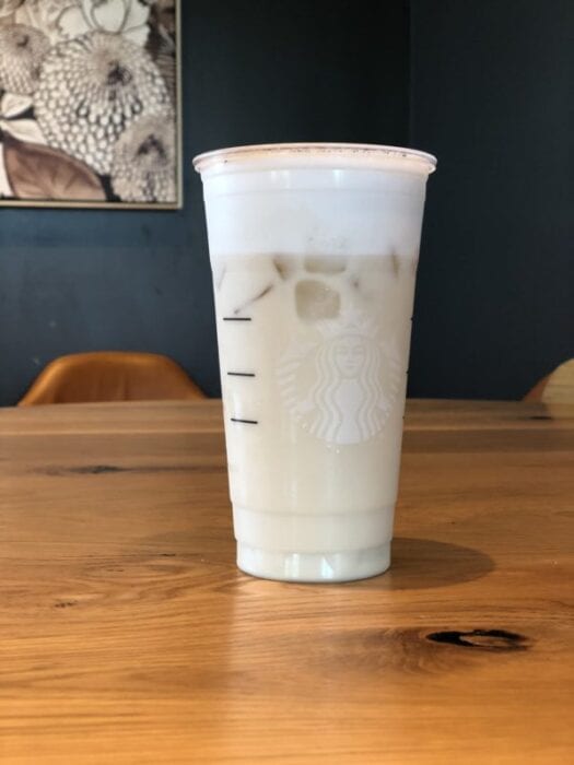 White drink in Starbucks cup