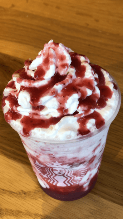 the Elf On The Shelf Frappuccino is a vanilla bean frappuccino with straberry puree and whipped cream