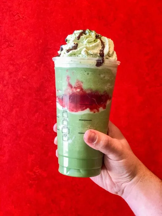 the Joker Frappuccino is a macha creme frapp with a creepy strawberry drizzle Joker-esque smile in the middle