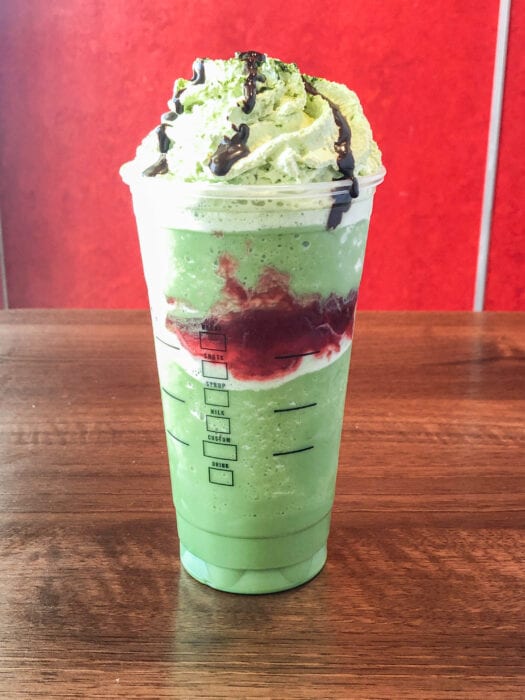 a matcha green tea creme frappuccino is the base for this Joker Frappuccino creation