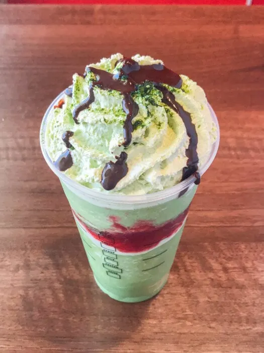 topped with matcha whipped cream, this Joker Frappuccino creation is a creepily sweet drink