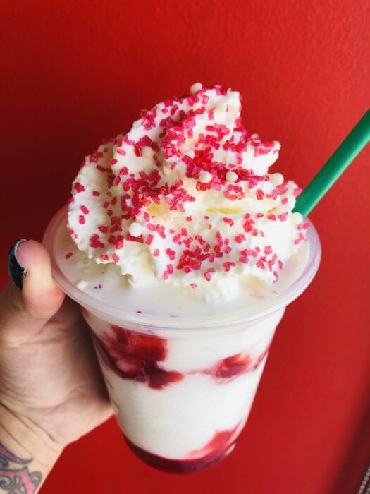 sweet whipped cream topped with red sugar sprinkles