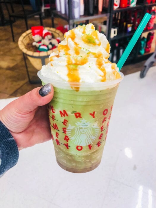 the Mandalorian Frappuccino is a matcha frappuccino topped with whipped cream and caramel drizzle