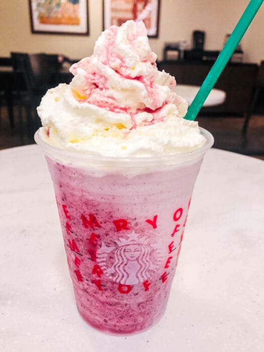 the base of this Frozen themed Starbucks Frappuccino is vanilla bean with sweet blackberry and blueberry flavor