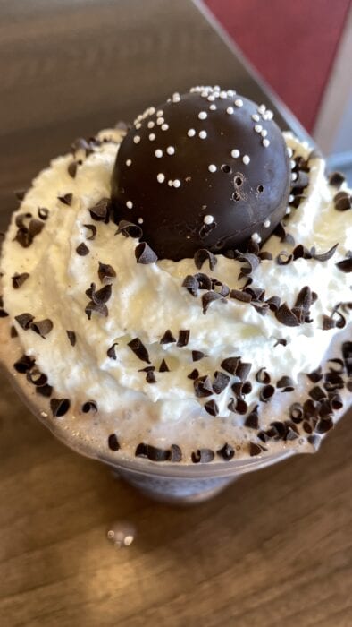 Our custom New Years Ball Drop Frappuccino is topped with a delicious chocolate cake pop