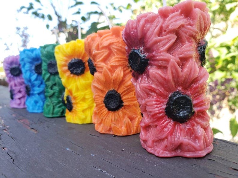 You Can Get Rainbow Sunflower Chakra Candles That Are Almost Too Pretty to Burn