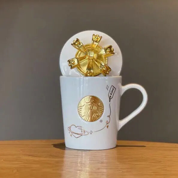 Starbucks' New Glass Tumbler Is Topped With a Gold Crown Lid for