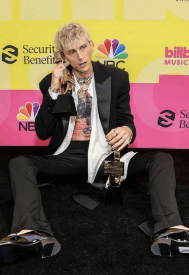 Why Did Machine Gun Kelly Painted His Tongue Black For The BMA's?