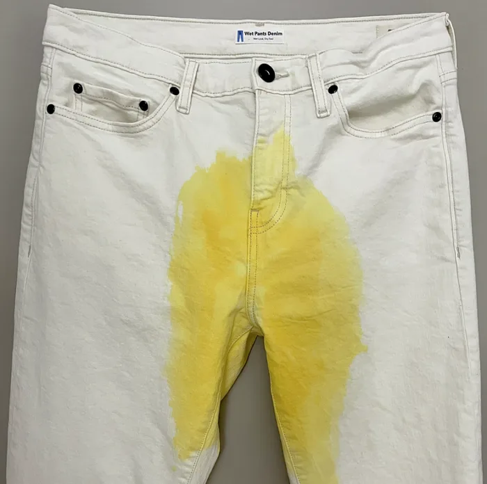 White Wet Pants Denim jeans with a yellow stain.