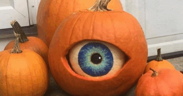 People Are Stuffing White Pumpkins Inside of Orange Pumpkins and Carving Them Into Eyes For Halloween