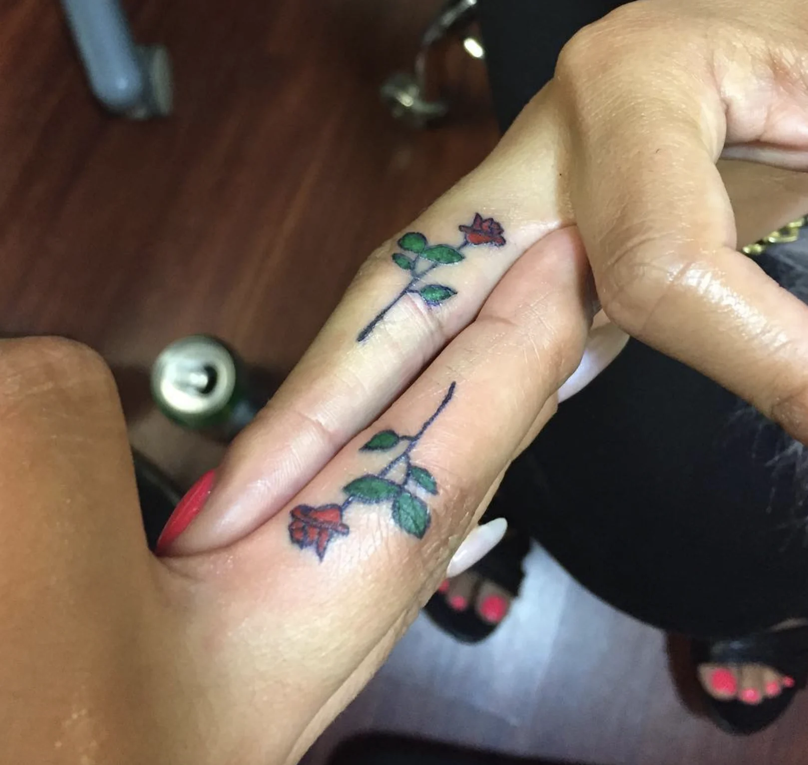 rose tattoo finger