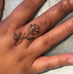 Simple Little Lotus Tattoo On Left Hand Finger