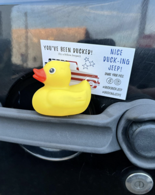 rubber duck on Jeep with tag