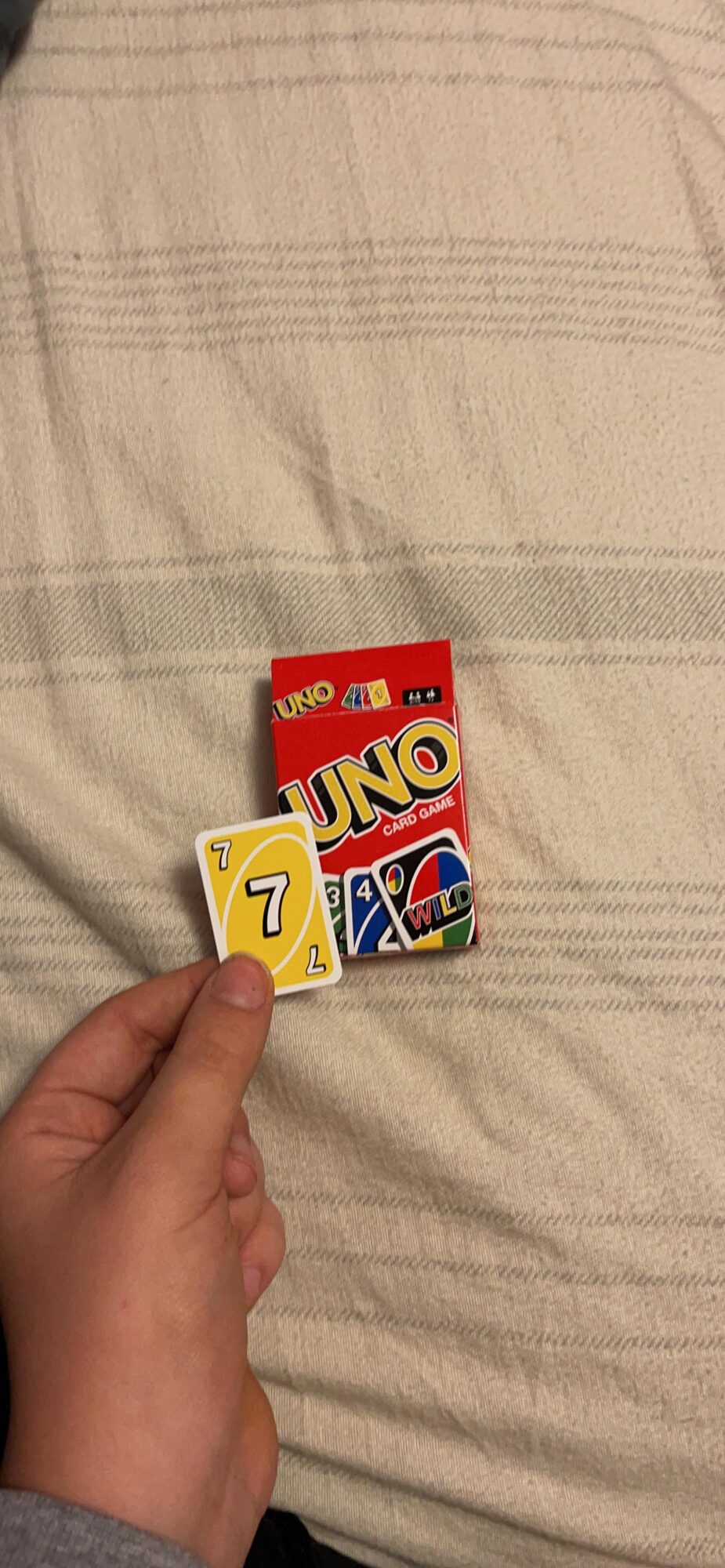 These mini Uno cards look like regular sized cards in my newborn nephew's  hands : r/mildlyinteresting
