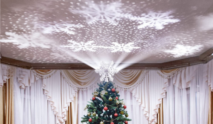 This Snowflake Christmas Tree Topper Projects Snow Onto Your Ceiling And It’s Gorgeous