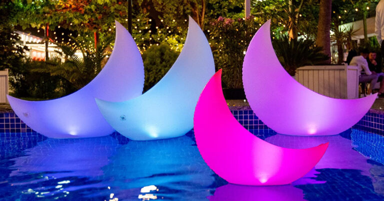 This Crescent Moon Pool Float Will Decorate Your Pool at Night With Neon Colors